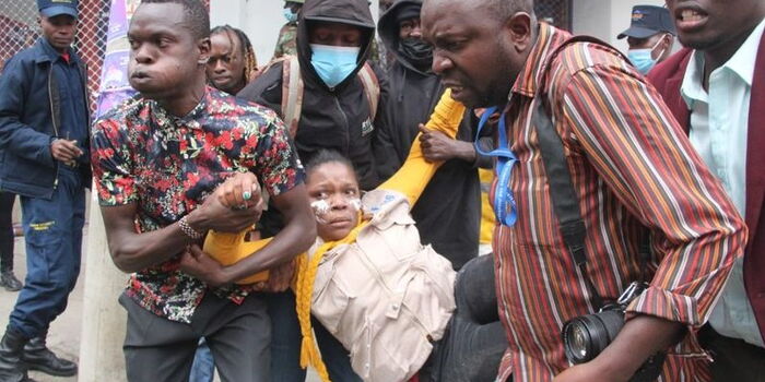 Catherine Wanjeri being lifted by fellow journalists. She was shot while covering the anti finance bill protests in Nakuru CBD on July 16, 2024. Photo/Facebook