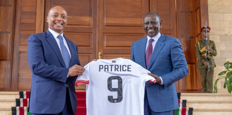 Caf President Patrice Motsepe hands a jersey to Kenya President William Ruto at the State House, Nairobi on September 16, 2024.