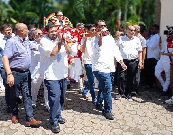 The body of Mombasa billionaire Hasmukh Patel, the owner of Mombasa Cement. being carried in public